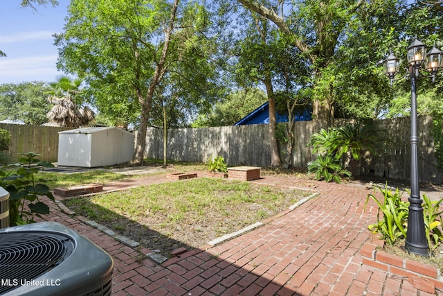 122 Carroll Ave, Long Beach, MS 39560 - fenced backyard featuring a storage unit and a patio