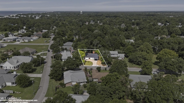 122 Carroll Ave, Long Beach, MS 39560 - aerial view of residential area featuring property parcel outlined and a heavily wooded area