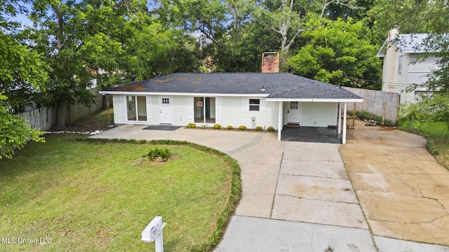 122 Carroll Ave, Long Beach, MS 39560 - ranch-style house featuring concrete driveway, a chimney, a carport, and roof with shingles