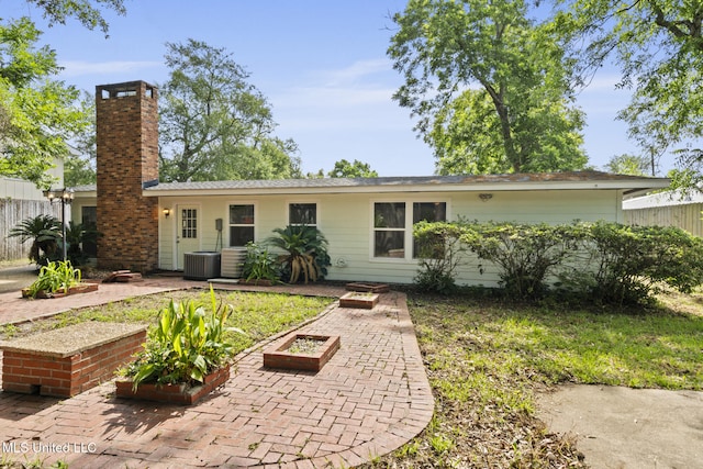 122 Carroll Ave, Long Beach, MS 39560 - view of front of house with a chimney and a patio