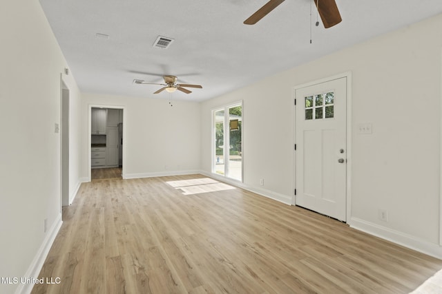 122 Carroll Ave, Long Beach, MS 39560 - unfurnished living room featuring ceiling fan and light wood-style floors