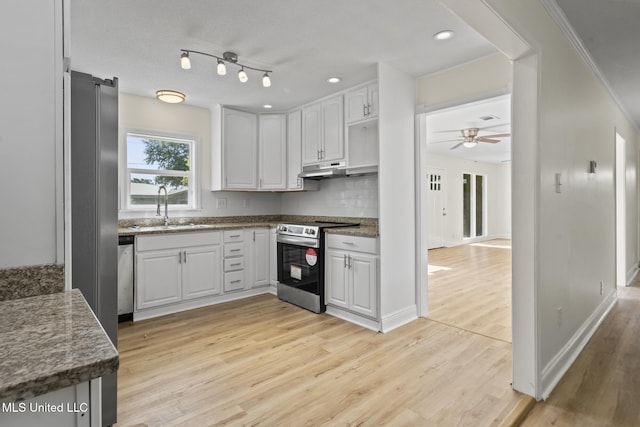 122 Carroll Ave, Long Beach, MS 39560 - kitchen with stainless steel appliances, light wood-type flooring, ceiling fan, white cabinets, and crown molding