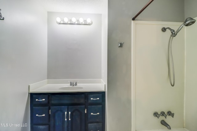 bathroom with shower / bathing tub combination and vanity