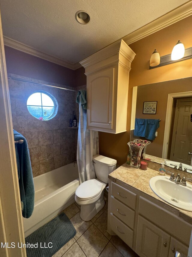 full bathroom featuring tile patterned floors, a textured ceiling, and ornamental molding