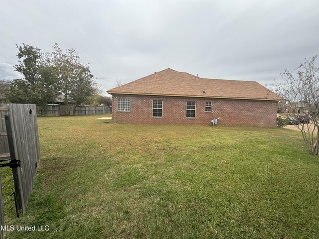 view of property exterior with a lawn