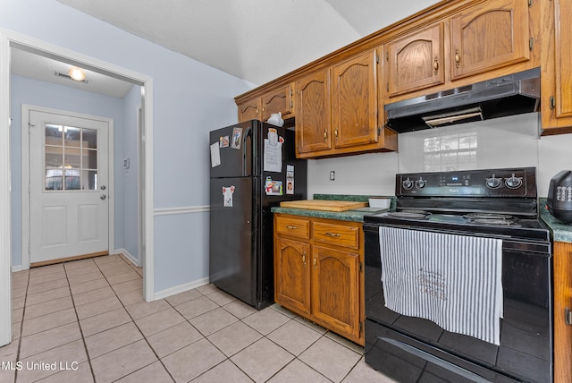 kitchen featuring black appliances and light tile patterned floors