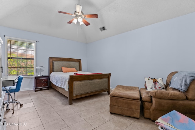 tiled bedroom with ceiling fan, a textured ceiling, and lofted ceiling