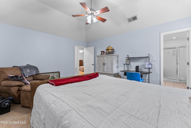 bedroom with ceiling fan, high vaulted ceiling, light tile patterned floors, and ensuite bathroom