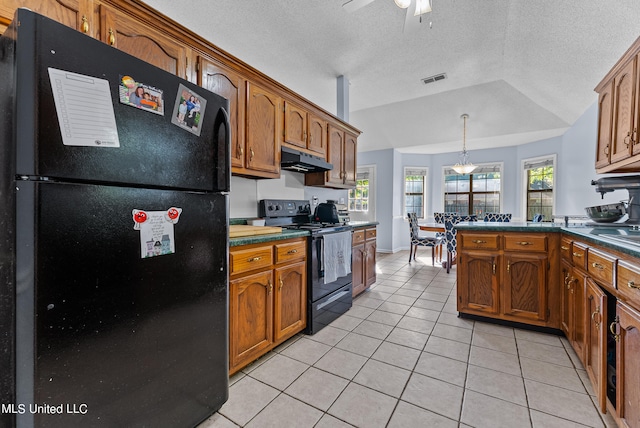 kitchen with hanging light fixtures, light tile patterned floors, ceiling fan, vaulted ceiling, and black appliances