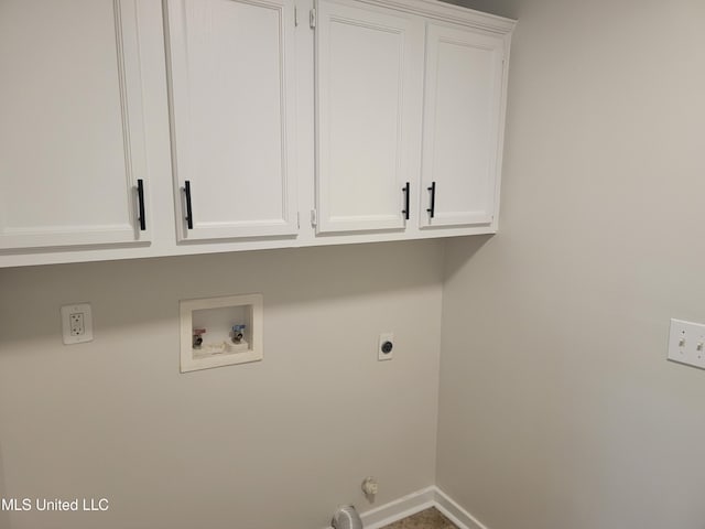 washroom featuring hookup for a washing machine, cabinet space, baseboards, and hookup for an electric dryer