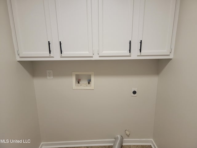 laundry area featuring baseboards, cabinet space, hookup for an electric dryer, and hookup for a washing machine