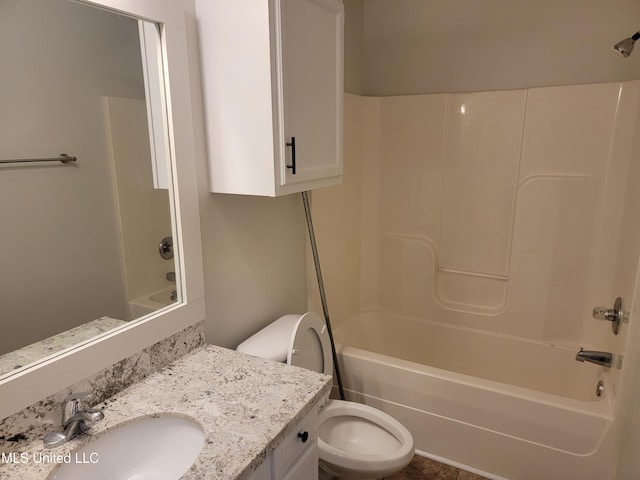 full bathroom featuring vanity, toilet, and  shower combination