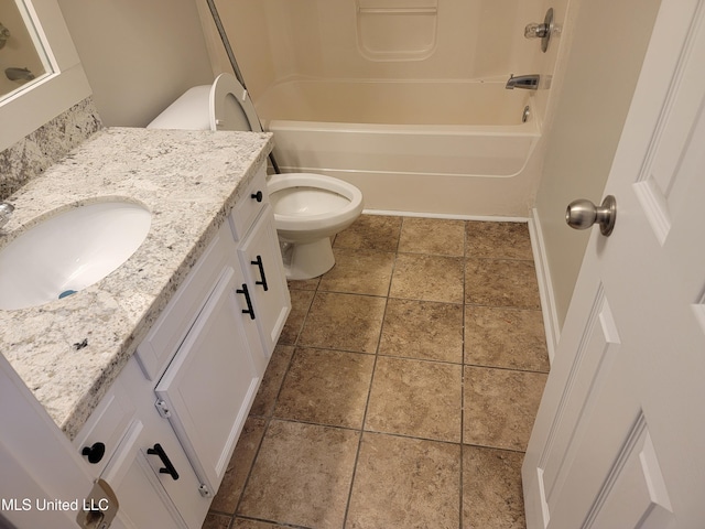 bathroom featuring bathing tub / shower combination, toilet, and vanity