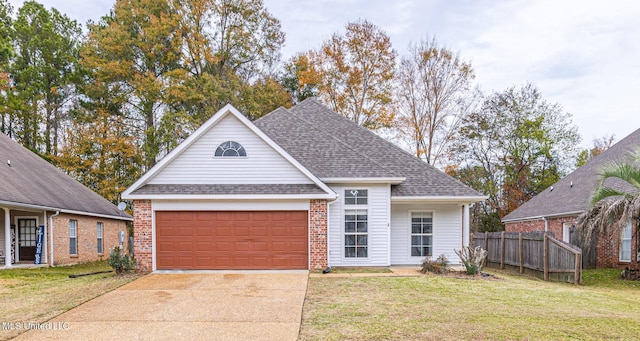 view of front of property with a garage and a front yard