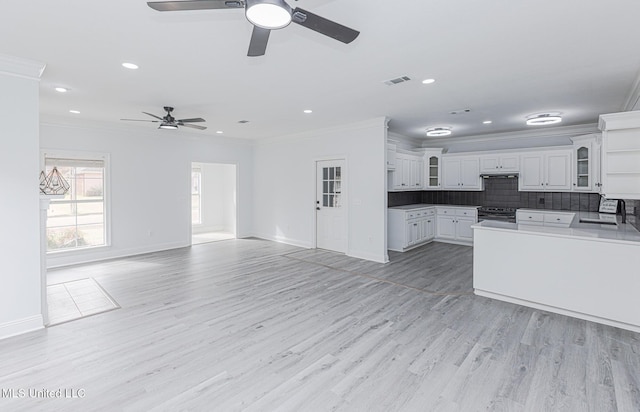 4954 Brookwood Pl, Byram, MS 39272 - kitchen with a ceiling fan, stainless steel electric range oven, crown molding, open floor plan, and glass insert cabinets