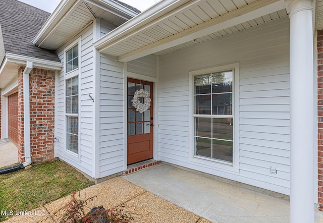 4954 Brookwood Pl, Byram, MS 39272 - view of exterior entry featuring roof with shingles and a garage