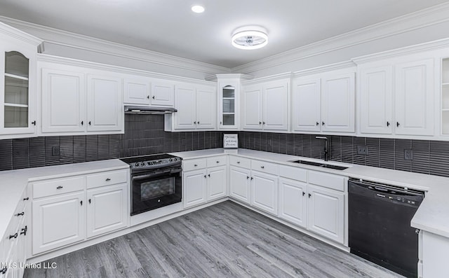 4954 Brookwood Pl, Byram, MS 39272 - kitchen featuring black appliances, white cabinets, light countertops, light wood-style floors, and ornamental molding