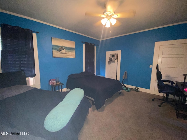 carpeted bedroom with baseboards, crown molding, and a ceiling fan