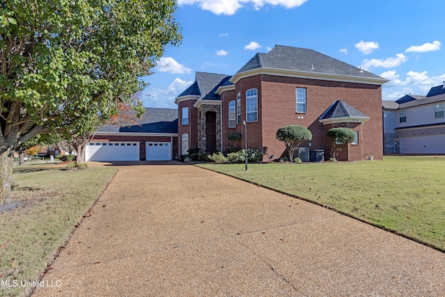 view of front property with a front lawn and a garage