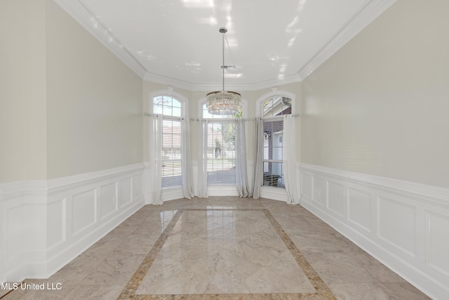 unfurnished dining area featuring a notable chandelier and ornamental molding