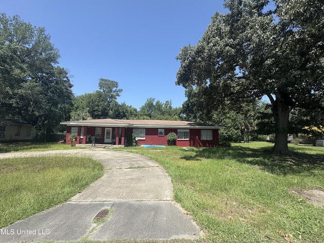 112 Olson Ave, Long Beach, MS 39560 - ranch-style house with a front lawn and driveway