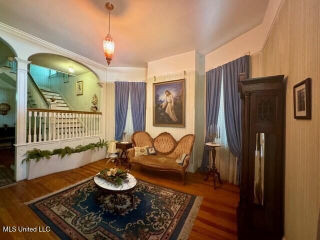 206 Linton Ave, Natchez, MS 39120 - sitting room featuring ornate columns, wood finished floors, stairs, and arched walkways