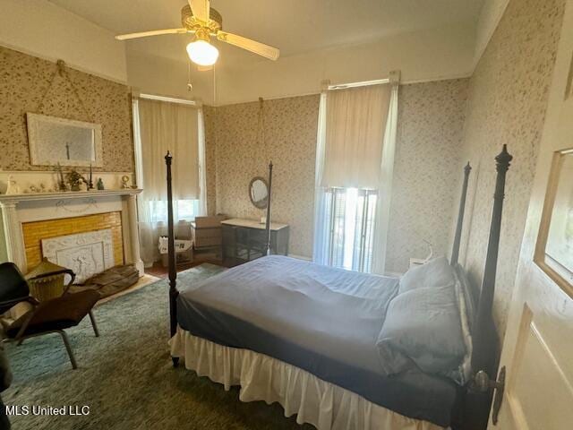 206 Linton Ave, Natchez, MS 39120 - bedroom featuring wallpapered walls, a high end fireplace, multiple windows, and ceiling fan