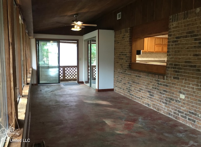 spare room with ceiling fan and lofted ceiling