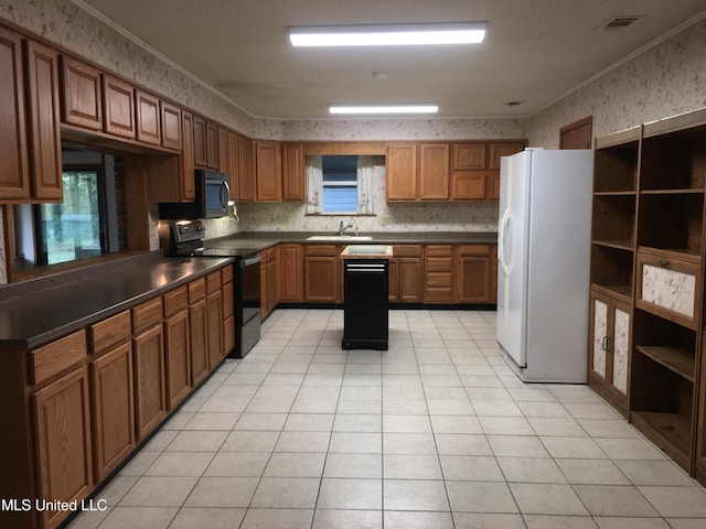 kitchen featuring light tile patterned flooring, sink, crown molding, and black appliances