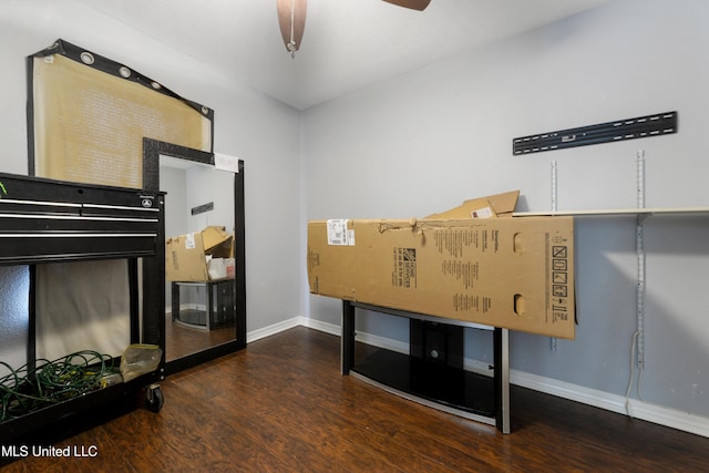 bedroom with baseboards and wood finished floors