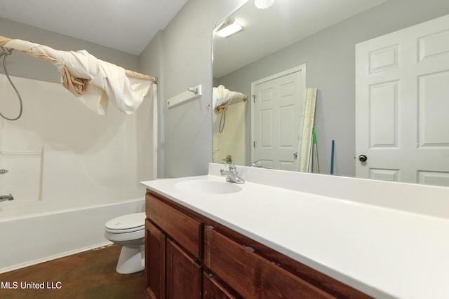 bathroom featuring vanity, shower / bathing tub combination, and toilet