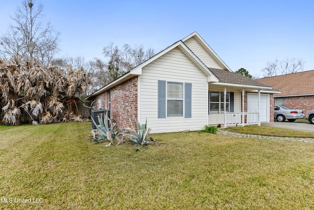 view of front of home with a front lawn, brick siding, concrete driveway, and an attached garage