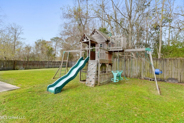 view of play area featuring a fenced backyard and a lawn