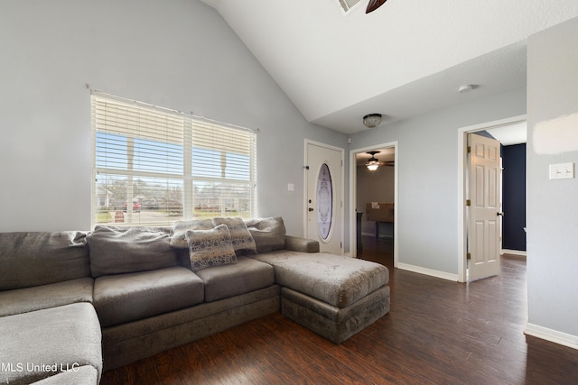 living room featuring dark wood finished floors, baseboards, high vaulted ceiling, and ceiling fan