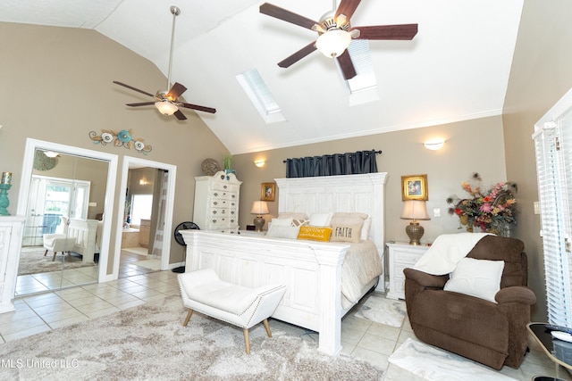 701 S Hill Ct, Biloxi, MS 39532 - bedroom with light tile patterned floors, a skylight, a ceiling fan, ensuite bathroom, and high vaulted ceiling