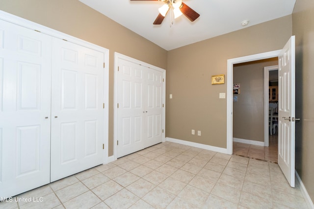 701 S Hill Ct, Biloxi, MS 39532 - unfurnished bedroom featuring multiple closets, light tile patterned floors, and ceiling fan
