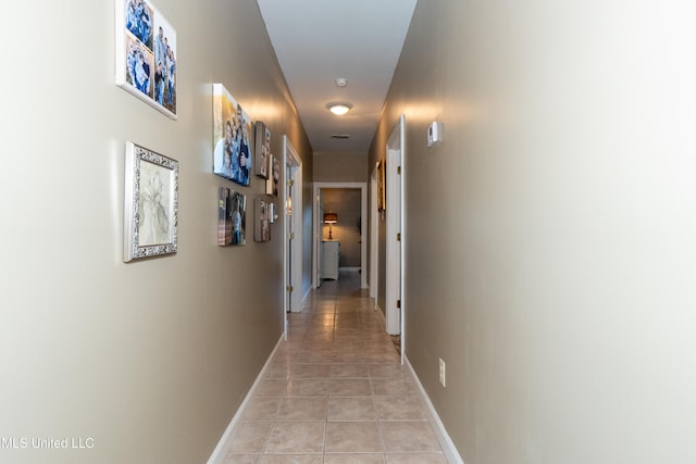 701 S Hill Ct, Biloxi, MS 39532 - hall with light tile patterned floors and baseboards
