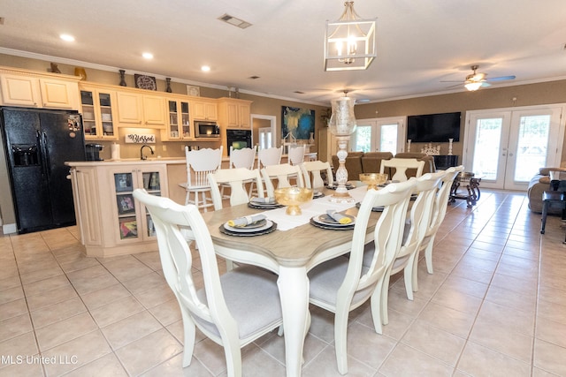 701 S Hill Ct, Biloxi, MS 39532 - dining area featuring crown molding, french doors, light tile patterned floors, recessed lighting, and a ceiling fan