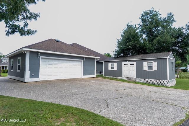 701 S Hill Ct, Biloxi, MS 39532 - view of front of property with a garage, an outdoor structure, and roof with shingles