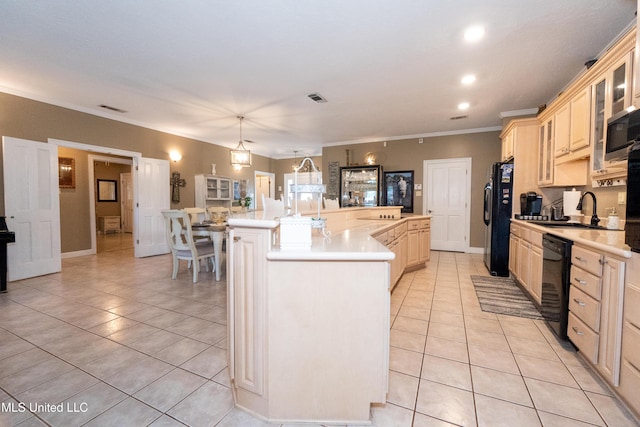 701 S Hill Ct, Biloxi, MS 39532 - kitchen featuring black appliances, light tile patterned floors, light brown cabinets, a spacious island, and recessed lighting