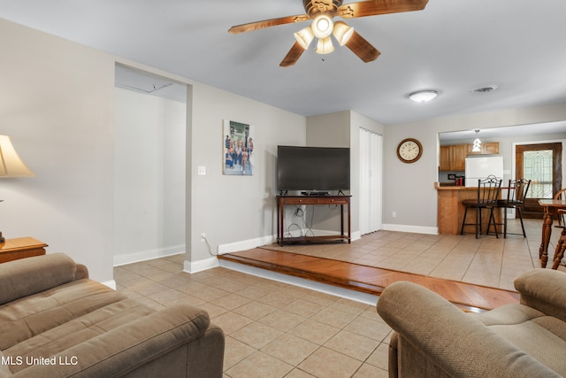 living room with light hardwood / wood-style floors and ceiling fan