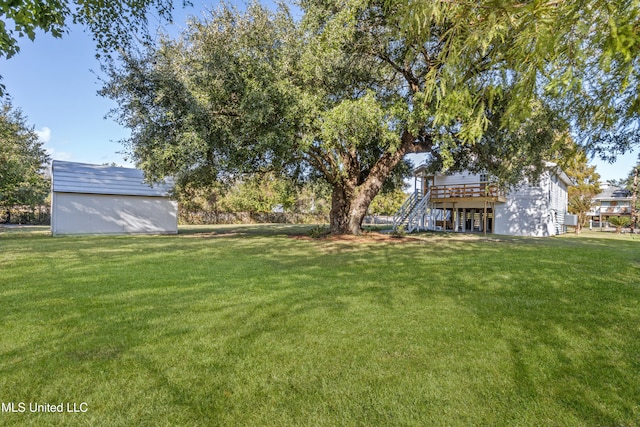 view of yard featuring a wooden deck