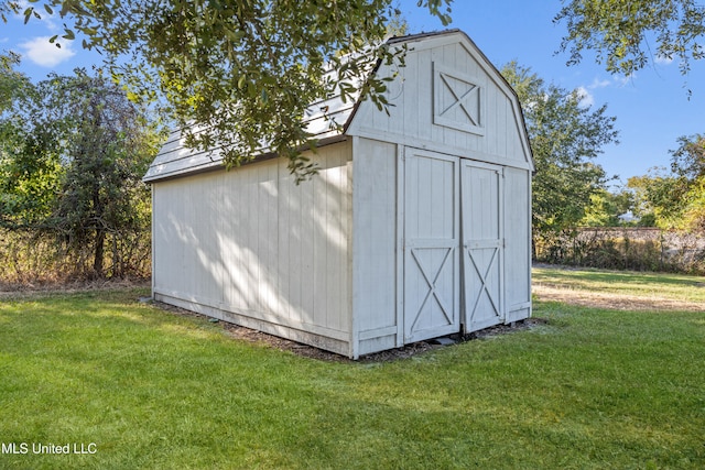 view of outdoor structure with a lawn