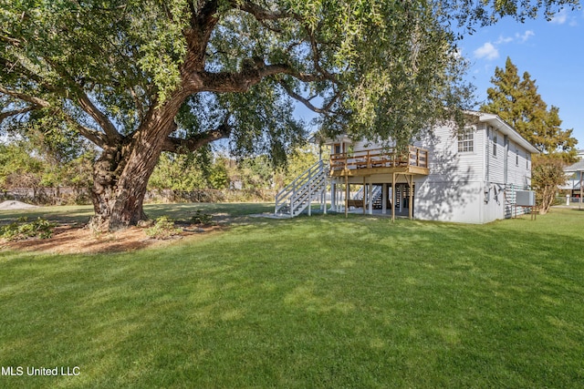 view of yard with a wooden deck