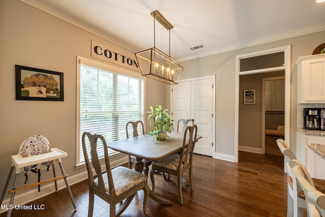 dining space featuring crown molding and dark hardwood / wood-style flooring