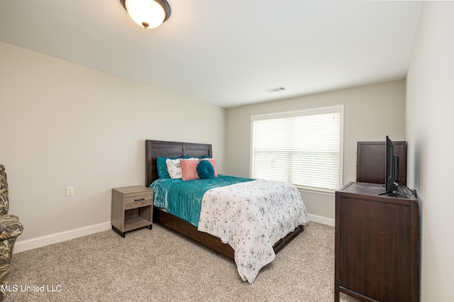 bedroom with light carpet