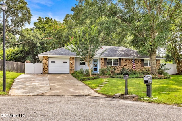 1219 Spring Dr, Long Beach, MS 39560 - view of front of house with a garage, concrete driveway, brick siding, and a shingled roof
