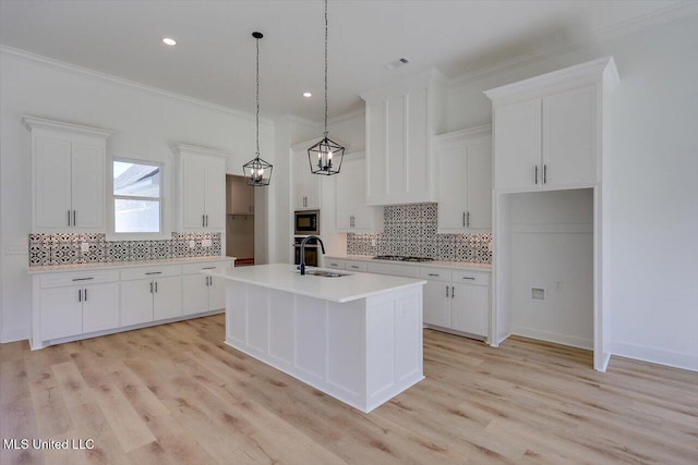 1025 Mullican Rd, Florence, MS 39073 - kitchen featuring decorative backsplash, built in microwave, a sink, light countertops, and white cabinets