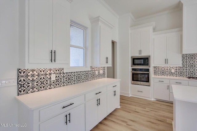 1025 Mullican Rd, Florence, MS 39073 - kitchen featuring black microwave, light countertops, decorative backsplash, and oven