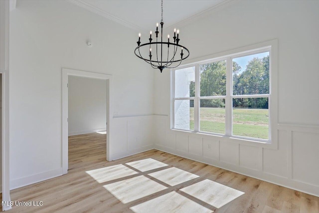 1025 Mullican Rd, Florence, MS 39073 - unfurnished dining area featuring crown molding, a chandelier, and wood finished floors